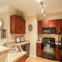 a kitchen with wood cabinets