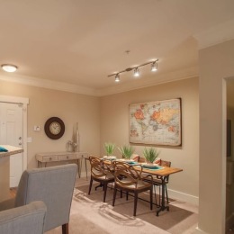 a dining room with a table and chairs