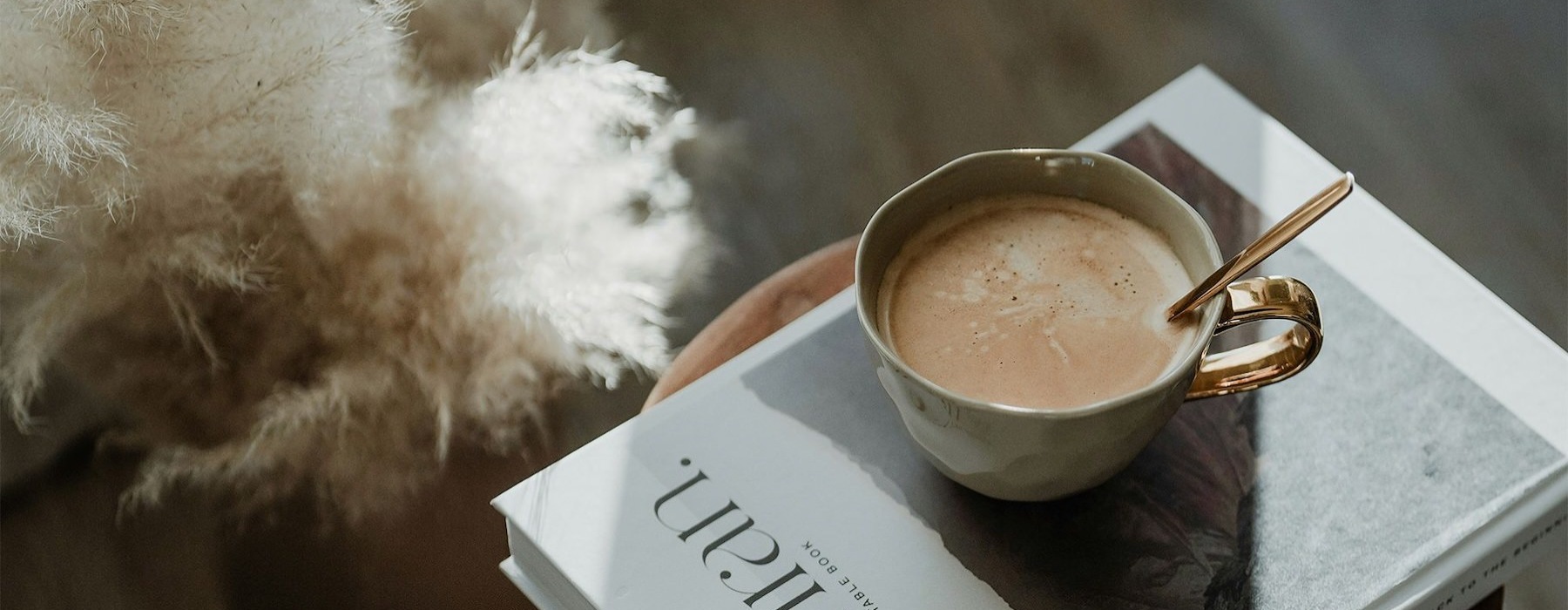a cup of coffee on a book