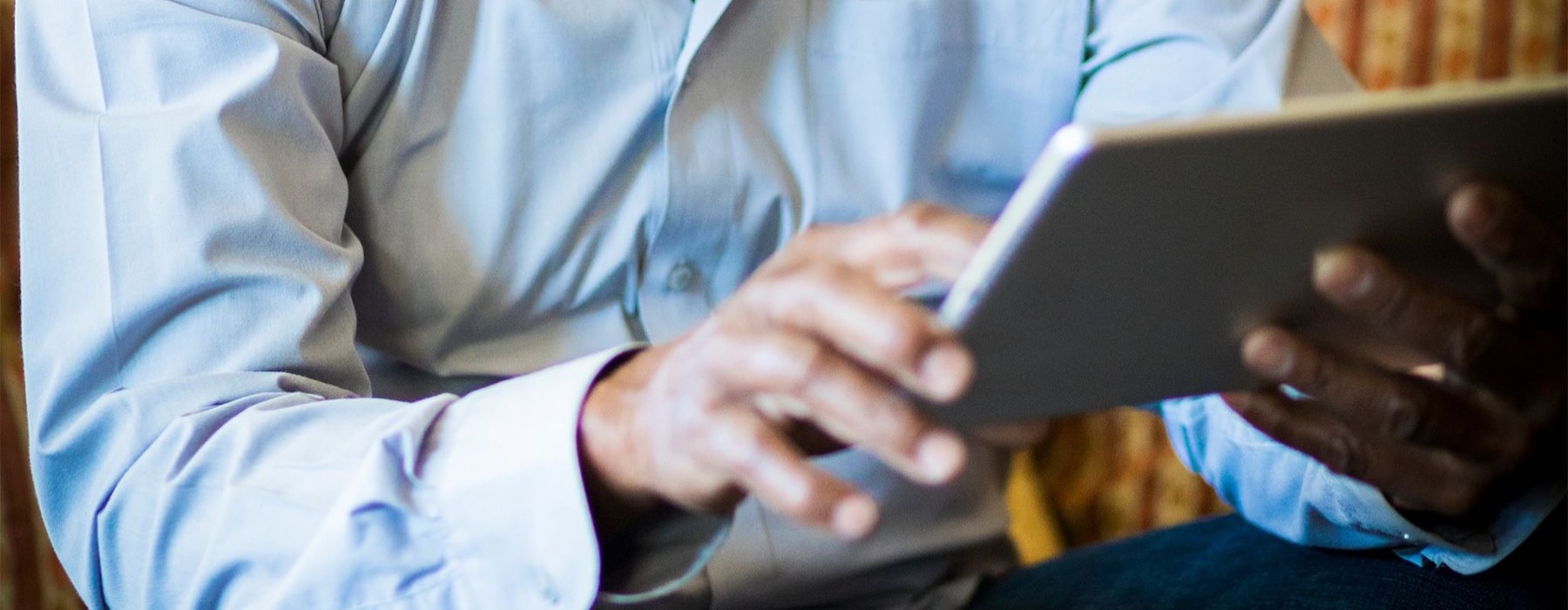 a man holding a tablet